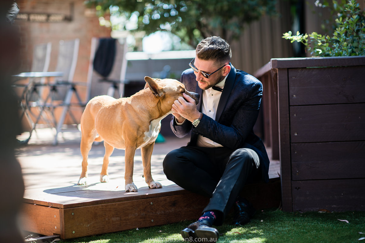groom and his dog